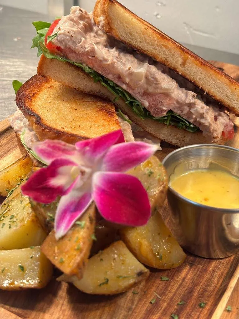 Cuban sandwich plated with French fries at Sensaciones Fort Myers